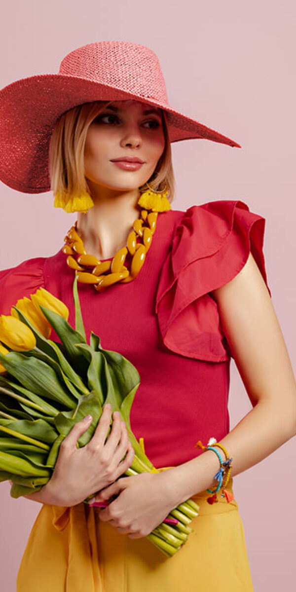 attractive-young-woman-in-elegant-hat-holding-bunc-2023-11-27-05-01-36-utc