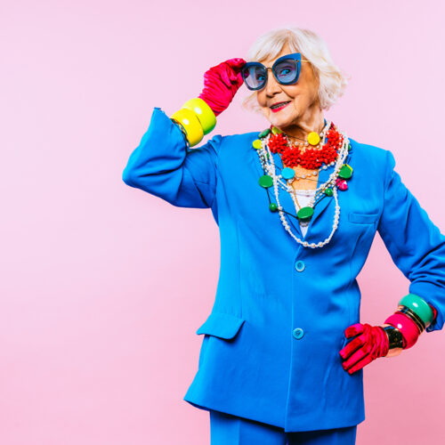 Happy and funny cool old lady with fashionable clothes portrait on colored background - Youthful grandmother with extravagant style, concepts about lifestyle, seniority and elderly people