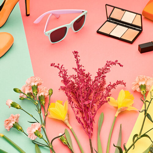 Fashion Summer Glamor Accessories minimal look. Woman stylish clothes collection falling on pastel geometry background. Trendy fashionable layout. Fashion advertising, top view.