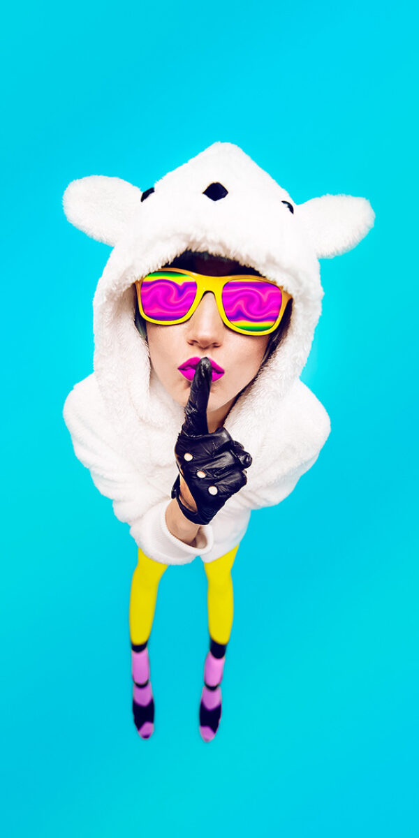 Funny girl in secret hoodie bear on a blue background. Guess her