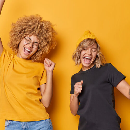 glad-carefree-young-women-dance-and-chill-indoor-d-2023-11-27-05-36-55-utc-2