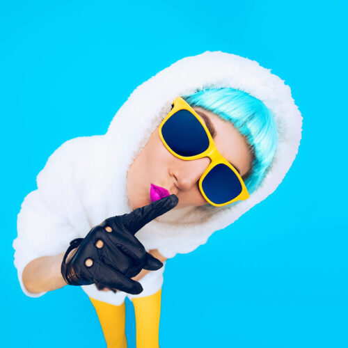 guess-fashion-girl-in-a-white-hoodie-on-a-blue-bac-2024-09-17-18-46-41-utc