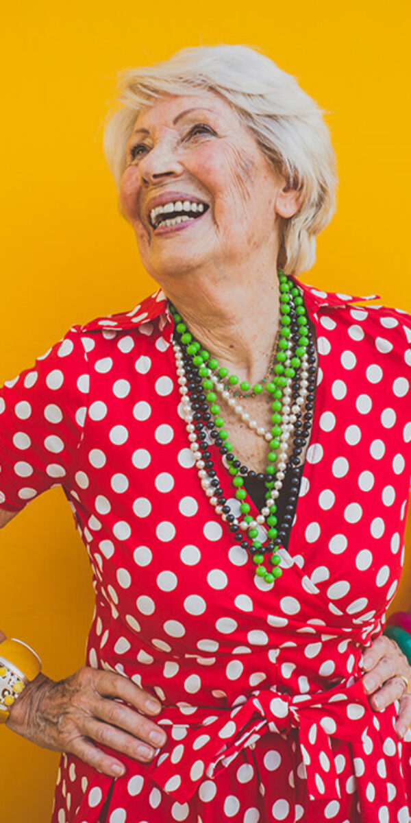 happy-grandmother-posing-on-colored-backgrounds-2023-11-27-05-16-54-utc