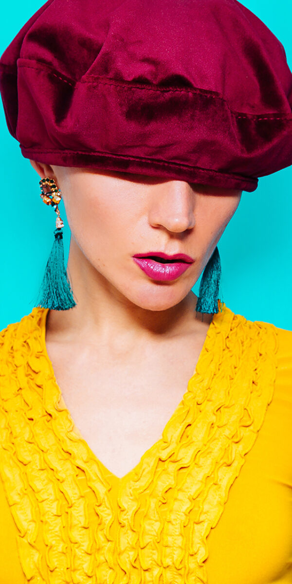 Model in fashion accessory beret and  jewelery  Vintage dress