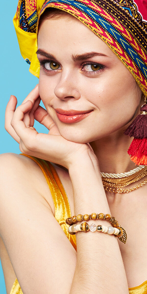 pretty woman ethnicity multicolored headscarf makeup glamor isolated background. High quality photo