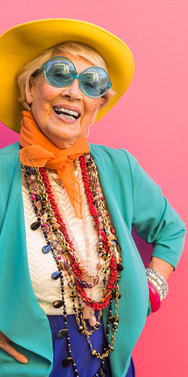 Happy and playful senior woman having fun - Portrait of a beautiful lady above 70 years old with stylish clothes, concepts about senior people